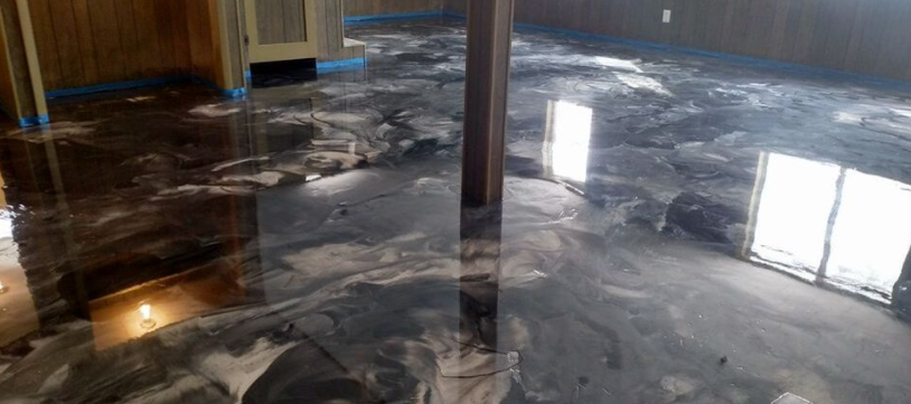 Metallic epoxy floor in a basement of Charlotte,NC. The work was done by Epoxy Floor Charlotte Pros.